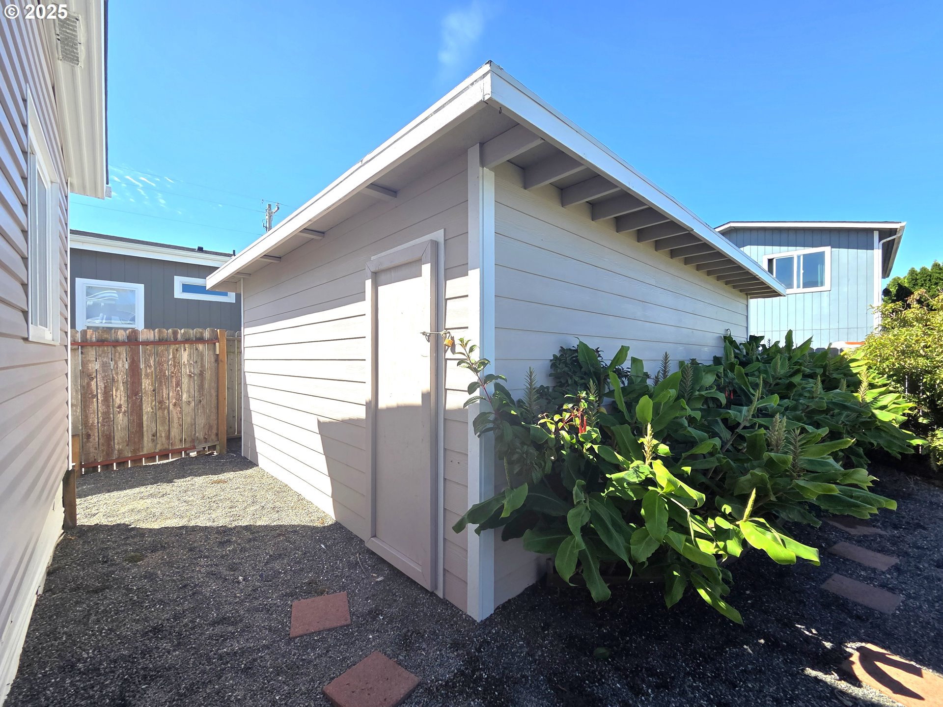 15889 Sunset Strip, Unit 102 Brookings, OR 97415 - Photo 25 of 27 a view of backyard with potted plants