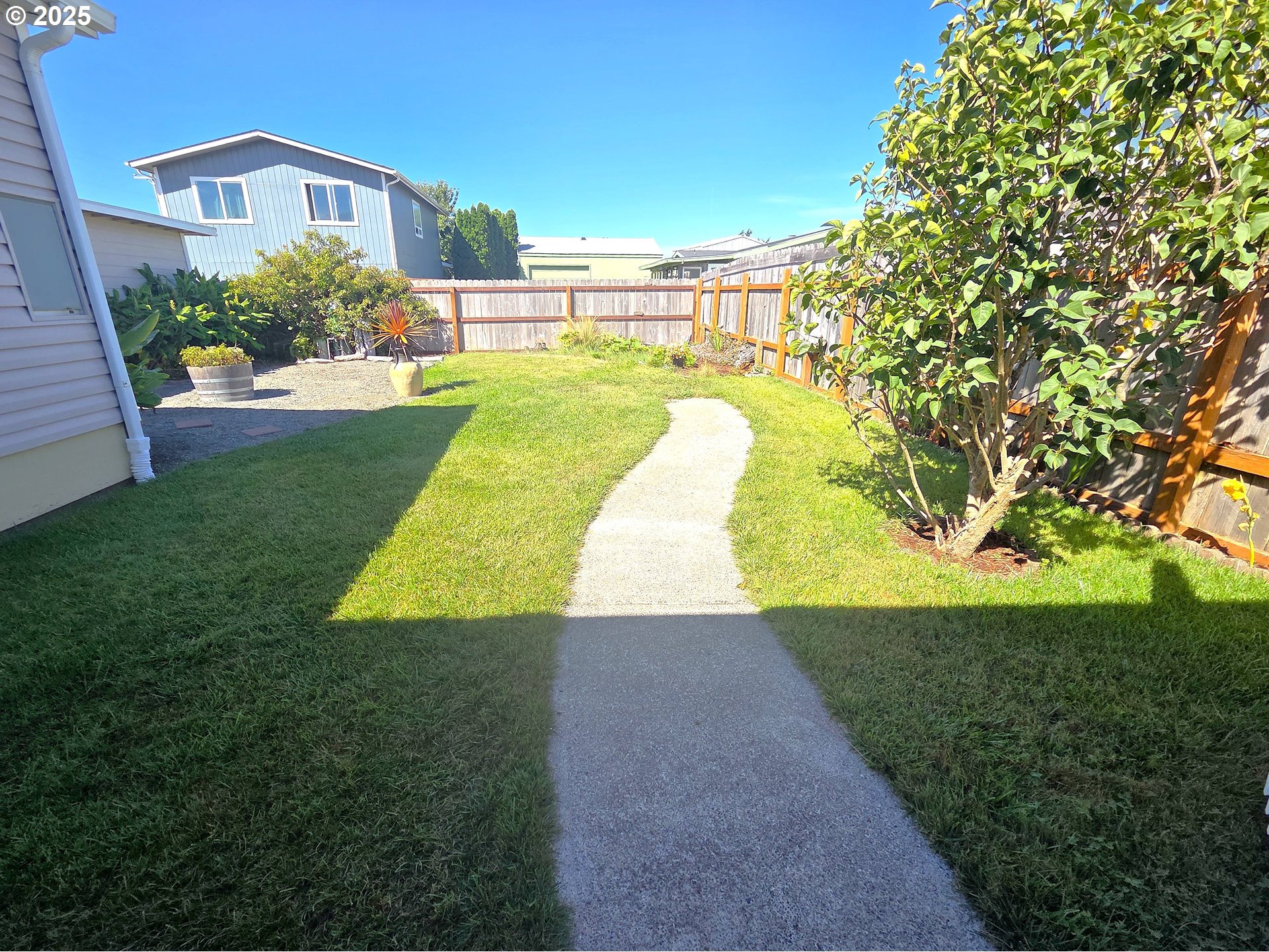 15889 Sunset Strip, Unit 102 Brookings, OR 97415 - Photo 26 of 27 a view of swimming pool with a yard