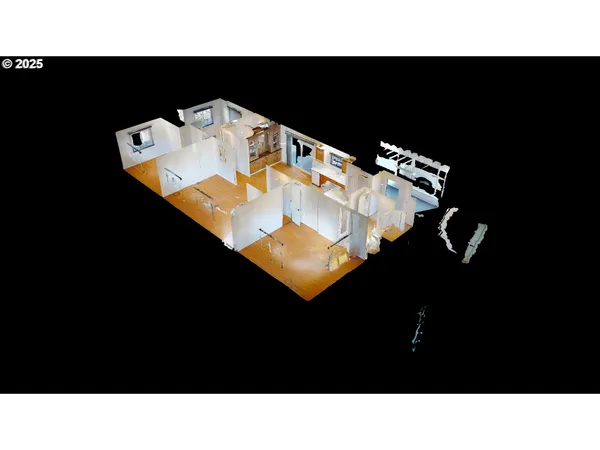 a view of a big room with wooden floor and a bathroom