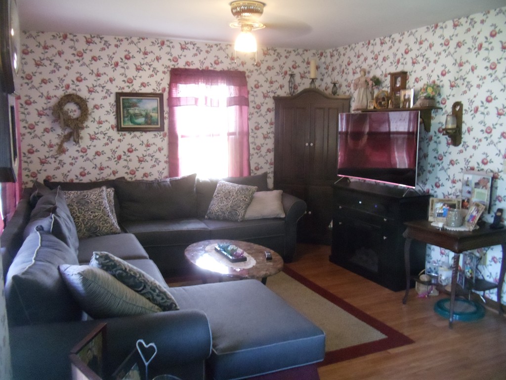 270 Lower Road Hardwick, MA 01031 - Photo 3 of 16 a living room with furniture and a fireplace