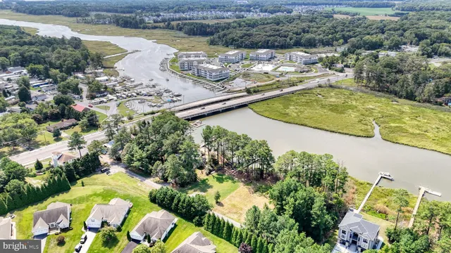 an aerial view of a house with a lake view