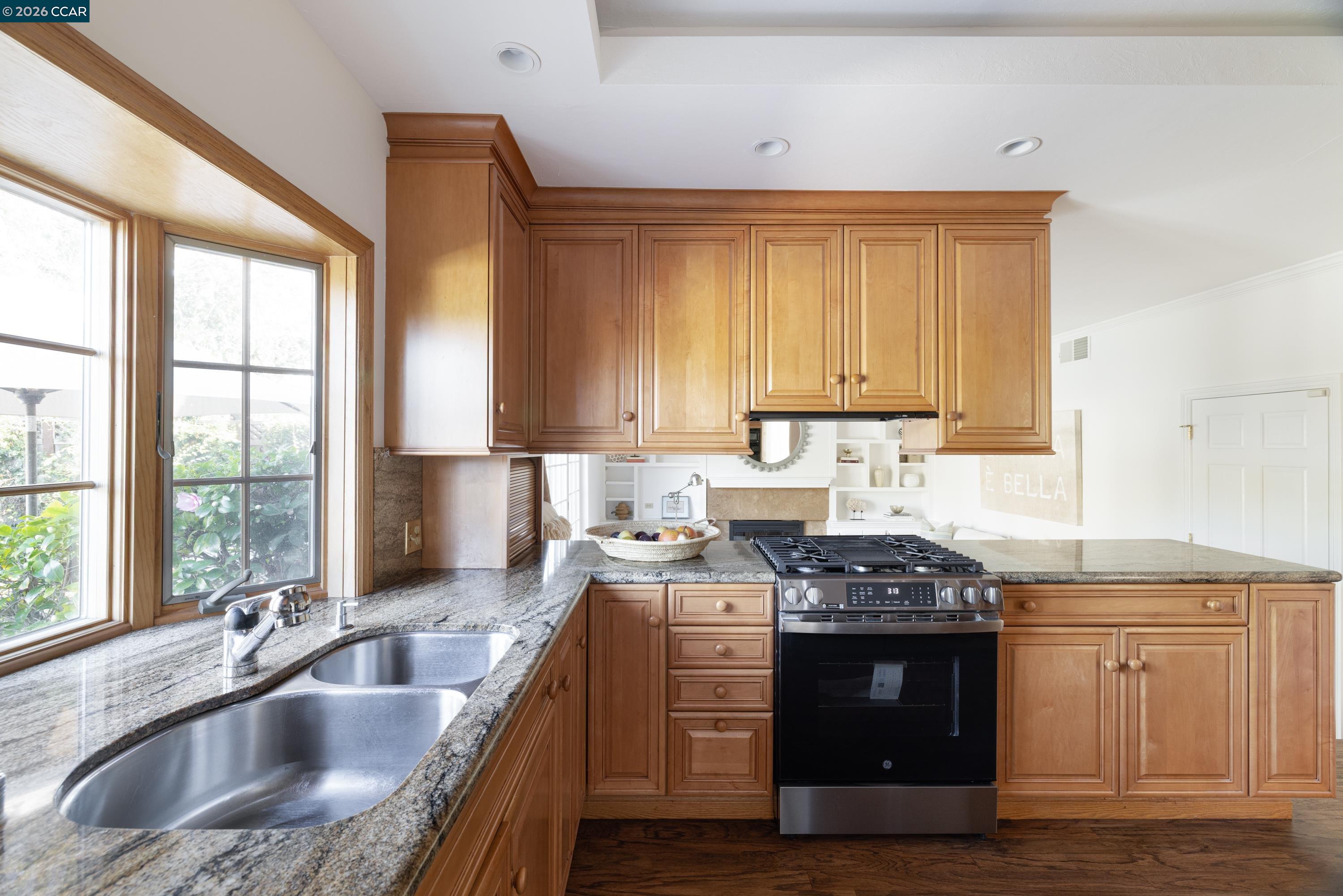 902 Kane Circle Walnut Creek, CA 94598 - Photo 14 of 40 a kitchen with stainless steel appliances granite countertop a sink stove and cabinets