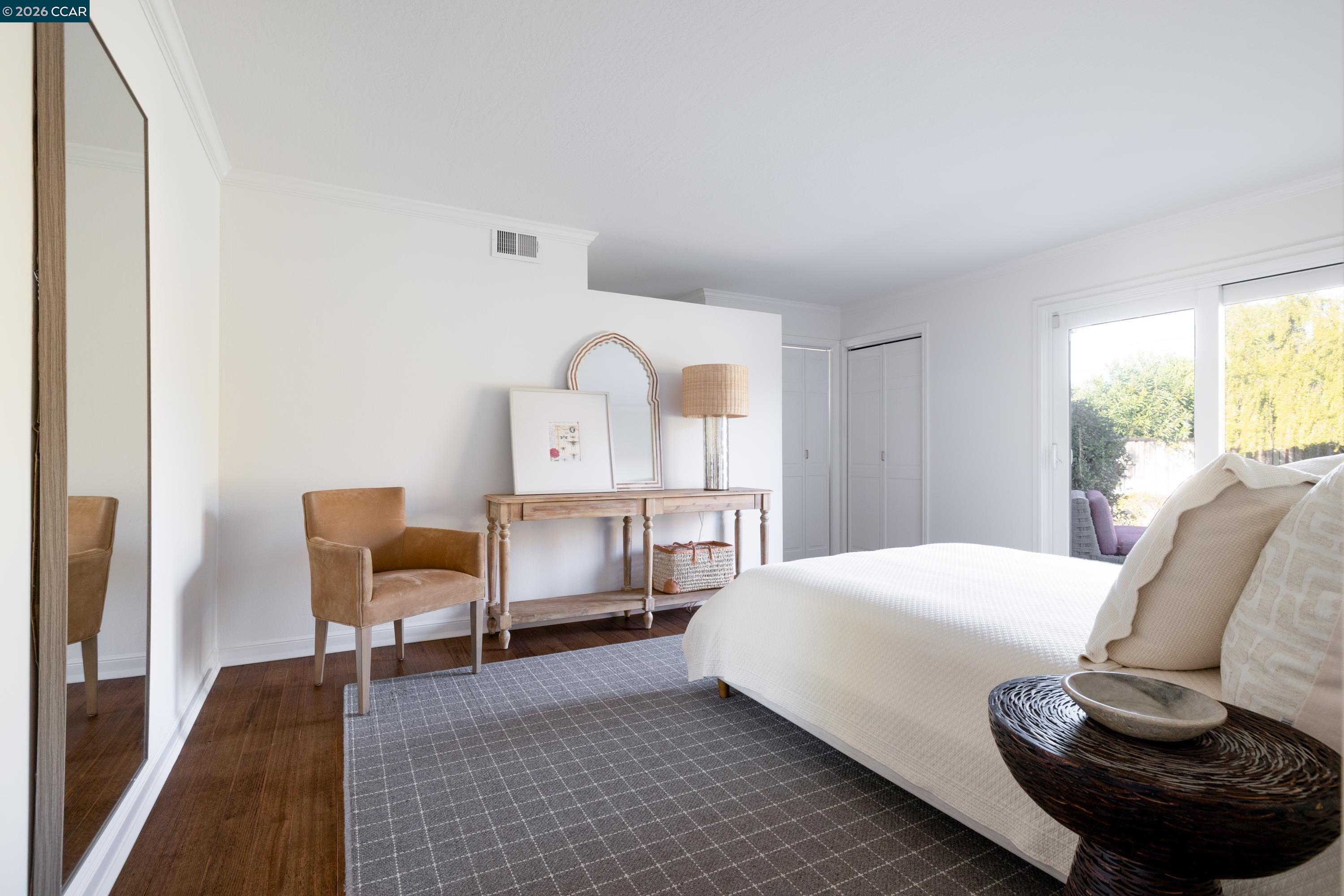 902 Kane Circle Walnut Creek, CA 94598 - Photo 19 of 40 a bedroom with a bed and chair