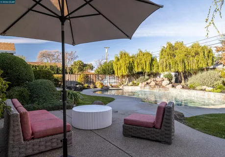 a view of a swimming pool with a patio