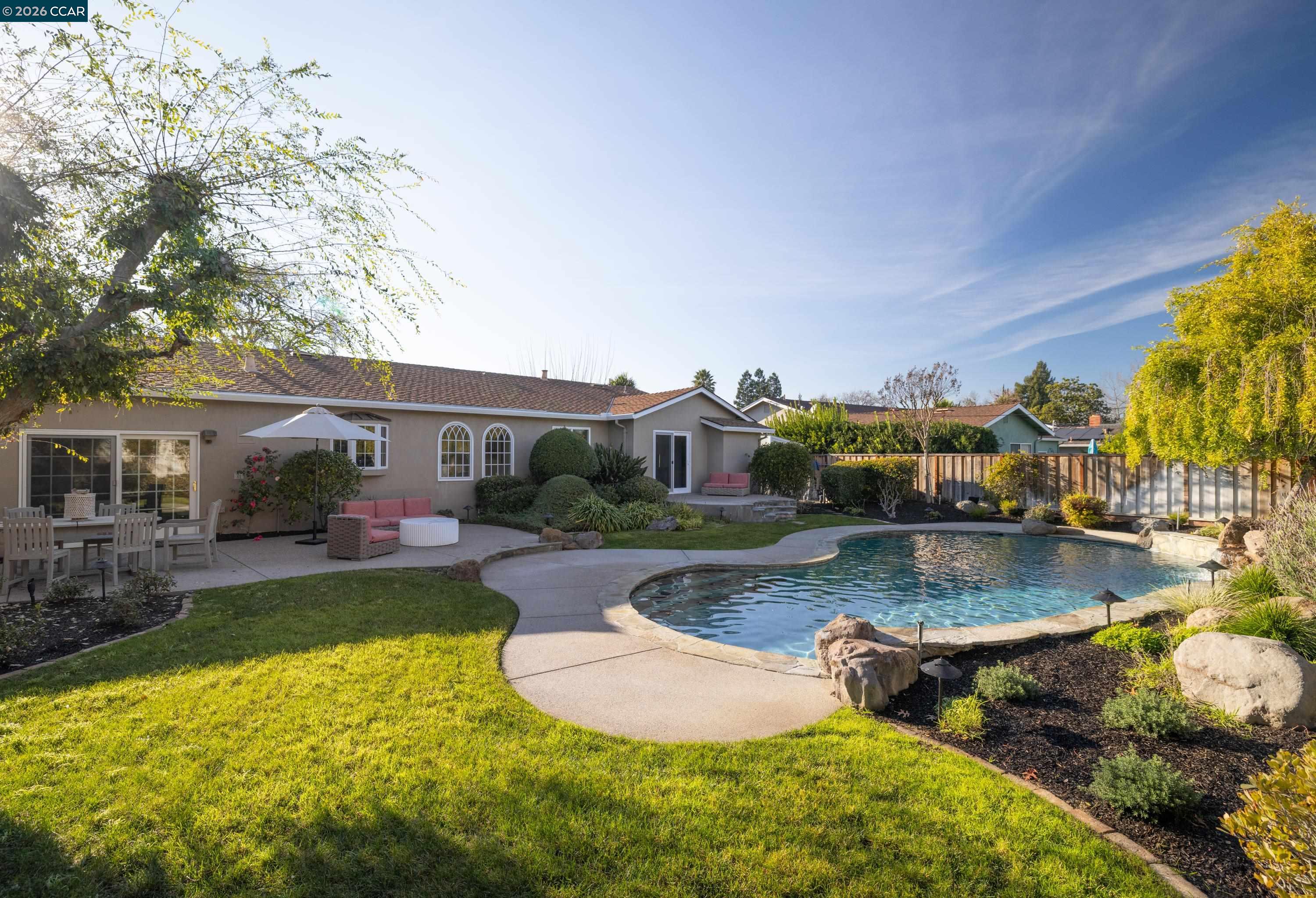 902 Kane Circle Walnut Creek, CA 94598 - Photo 32 of 40 a view of a swimming pool with a patio