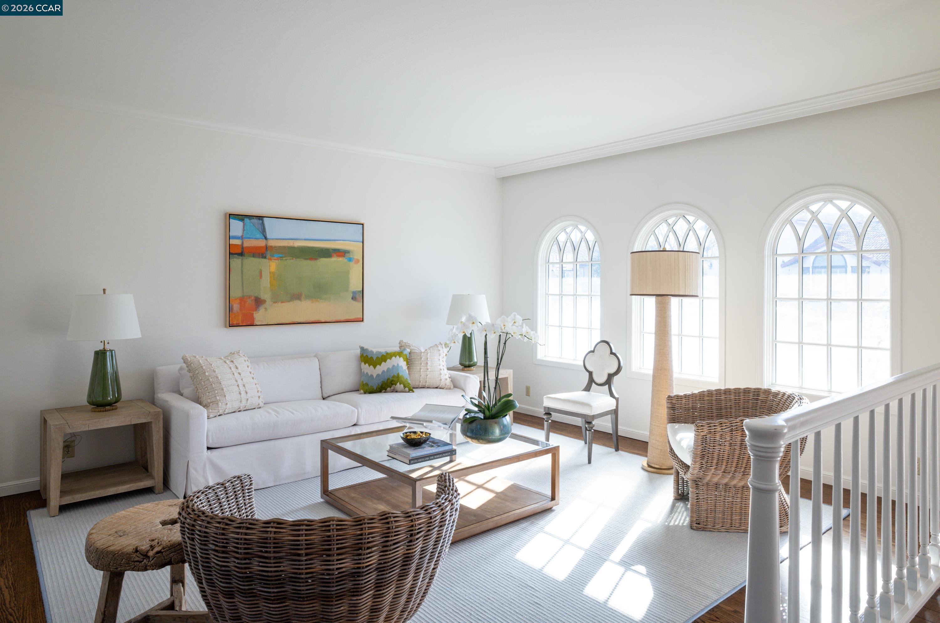 902 Kane Circle Walnut Creek, CA 94598 - Photo 4 of 40 a living room with furniture a fireplace and a chandelier