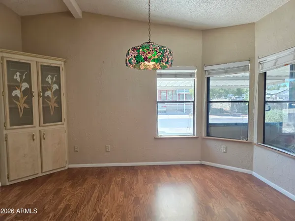 a view of livingroom with hardwood floor and ceiling fan