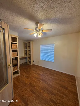 a view of hallway with wooden floor