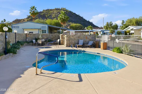 a view of a swimming pool with a patio