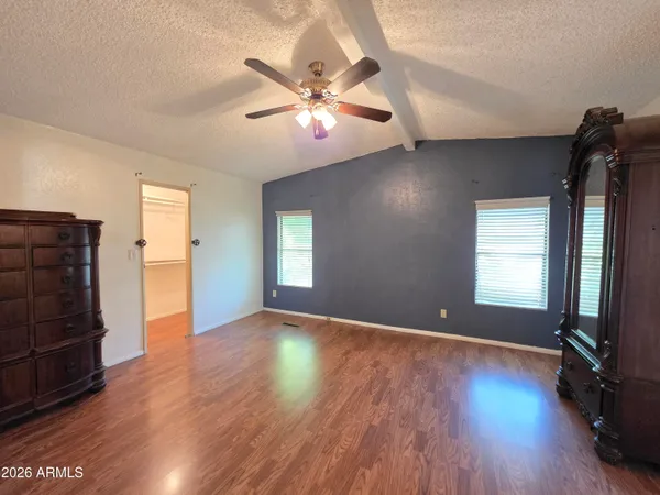 a view of a room with wooden floor