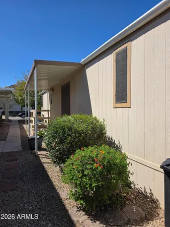 a view of a livingroom with furniture and a floor to ceiling window