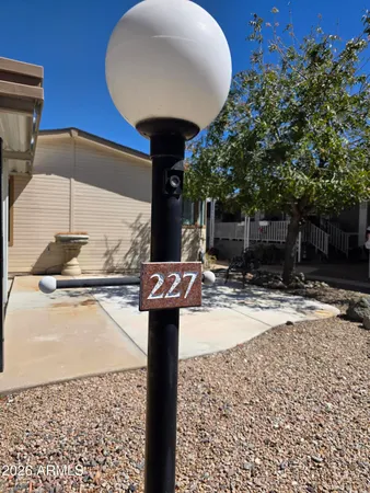 a living room with furniture and floor to ceiling window