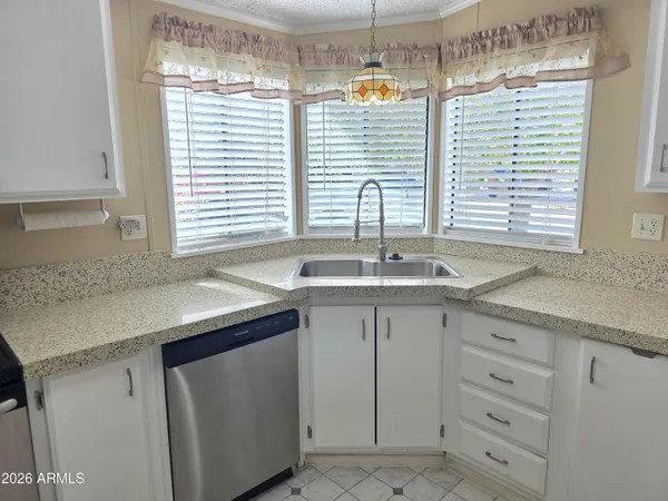 a kitchen with a sink and cabinets