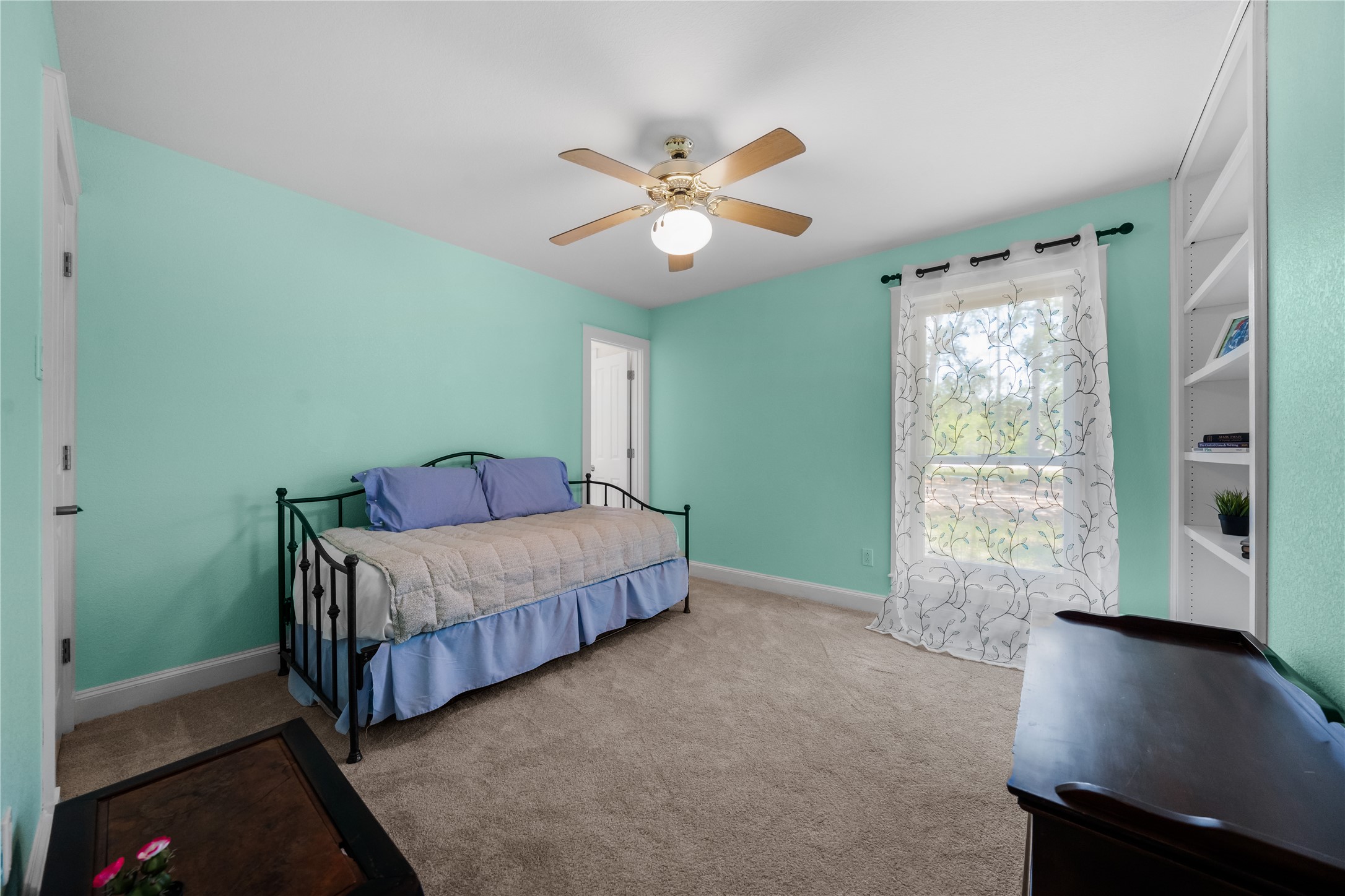 7670 Nez Perce Trace Manor, TX 78653 - Photo 17 of 40 Bedroom featuring baseboards, a ceiling fan, and carpet flooring