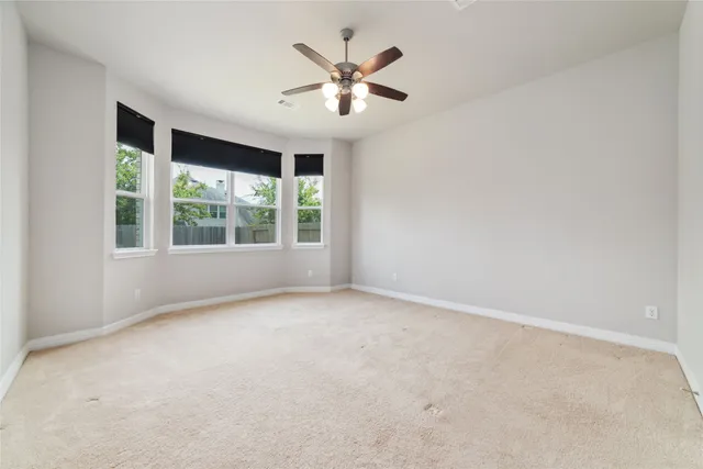a spacious bathroom with a tub sink shower and mirror