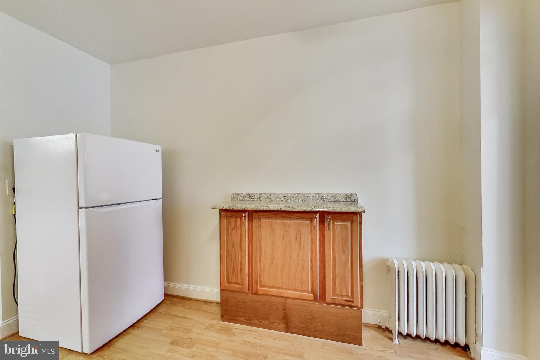 137 R Street Northeast Washington, DC 20002 - Photo 14 of 28 a view of a livingroom with wooden floor