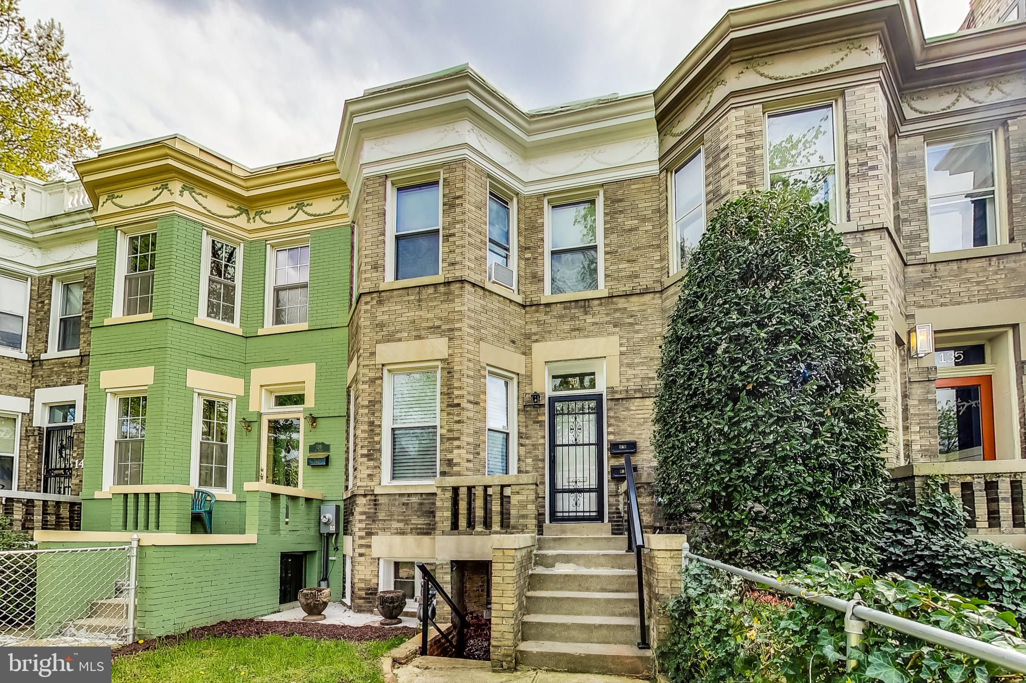 137 R Street Northeast Washington, DC 20002 - Photo 2 of 28 front view of a building with a yard