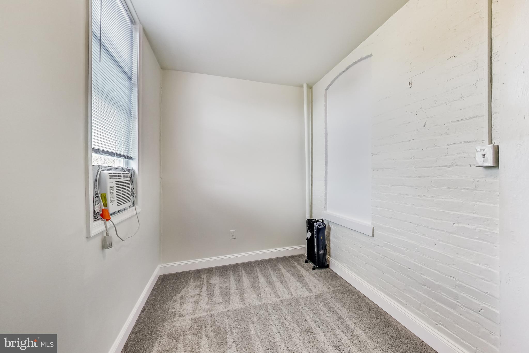 137 R Street Northeast Washington, DC 20002 - Photo 25 of 28 an empty room with a window