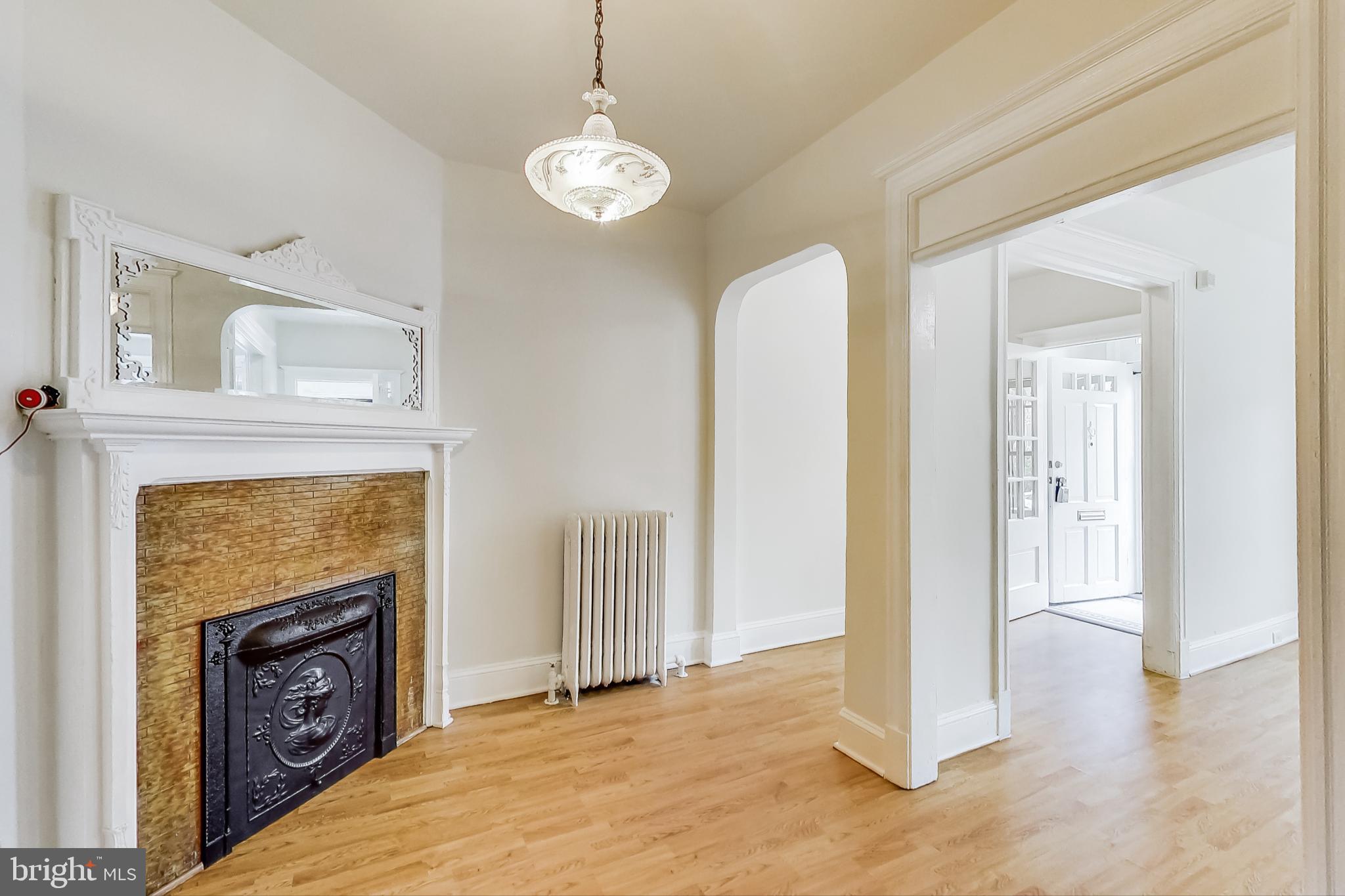 137 R Street Northeast Washington, DC 20002 - Photo 8 of 28 a view of livingroom with hardwood floor and fireplace