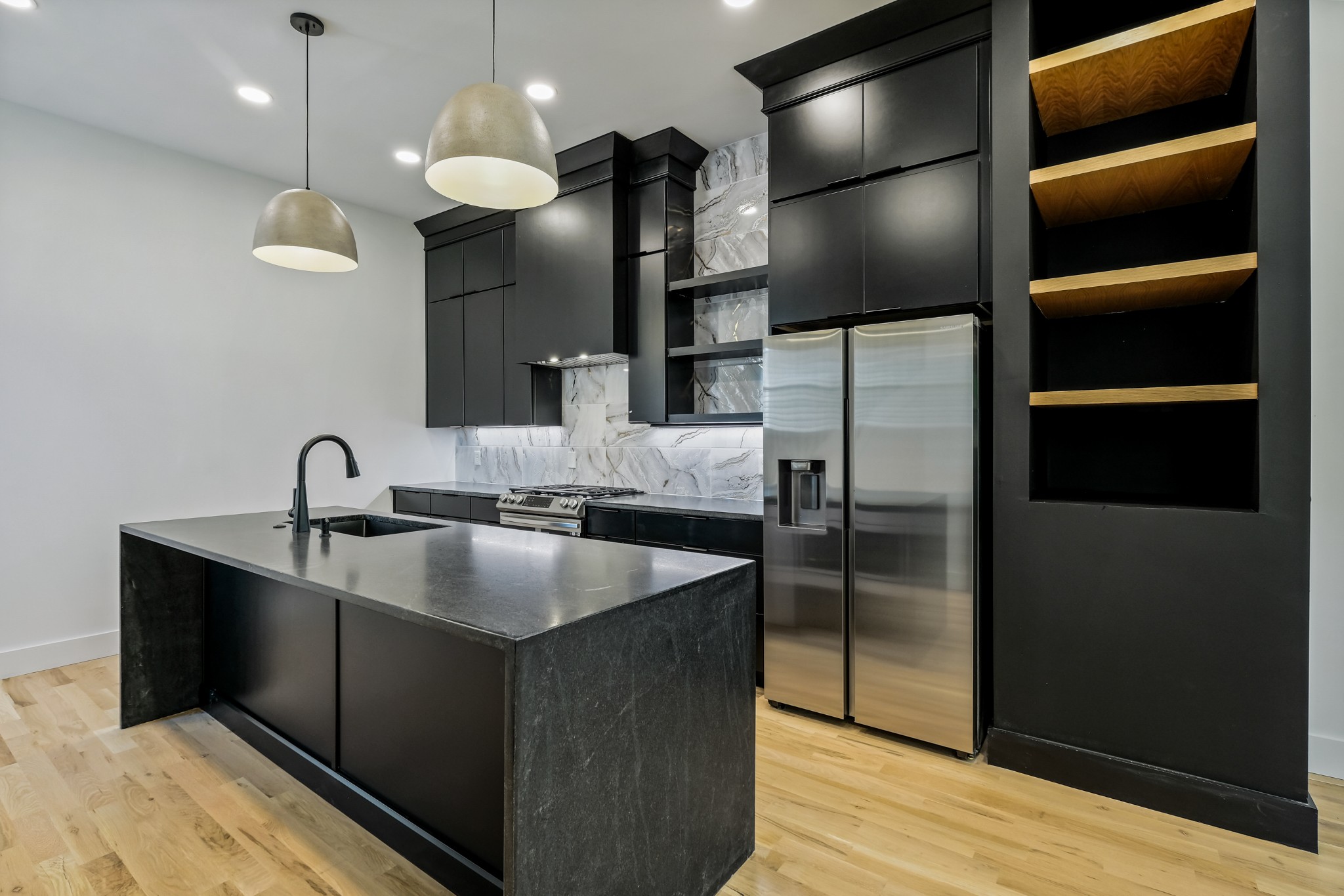 629 B Ries Avenue Nashville, TN 37209 - Photo 11 of 62 a kitchen with kitchen island a counter top space cabinets and stainless steel appliances