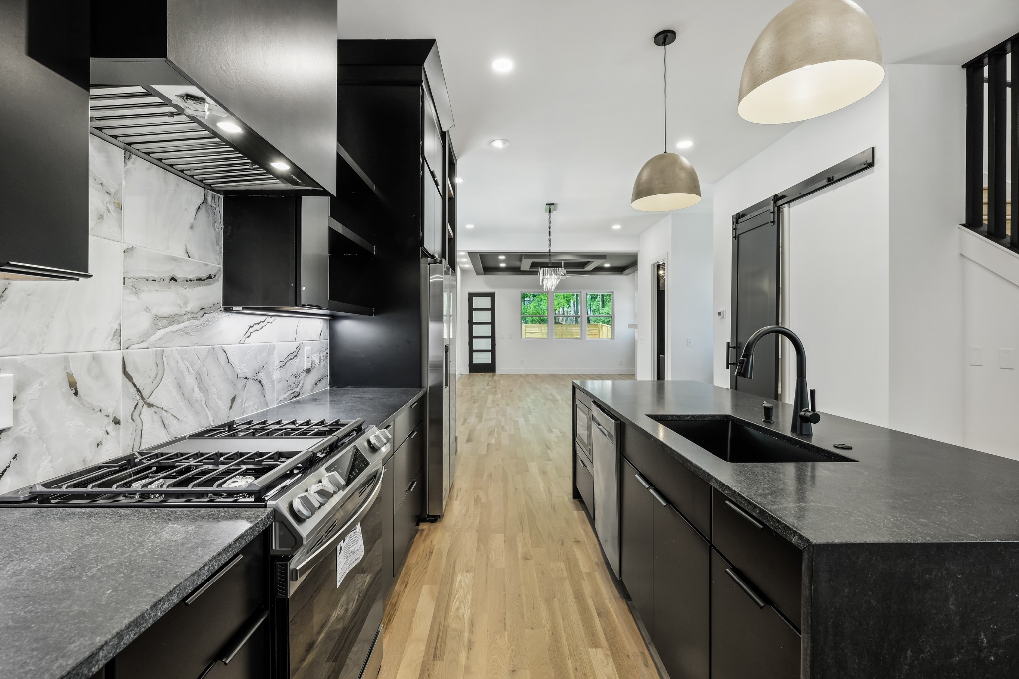 629 B Ries Avenue Nashville, TN 37209 - Photo 14 of 62 a kitchen with kitchen island granite countertop a sink stainless steel appliances and cabinets