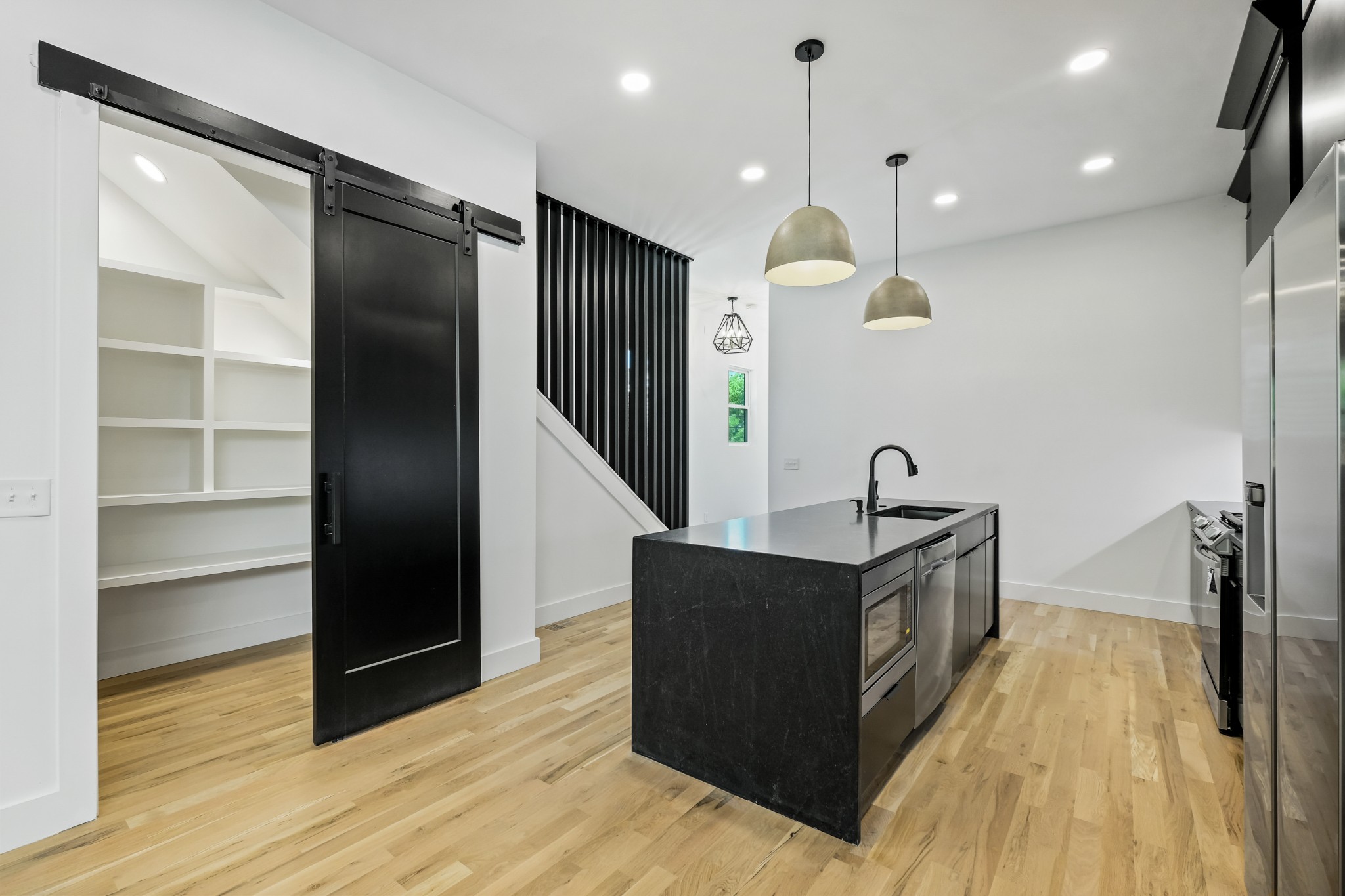 629 B Ries Avenue Nashville, TN 37209 - Photo 18 of 62 a kitchen with stainless steel appliances granite countertop a sink and a stove top oven