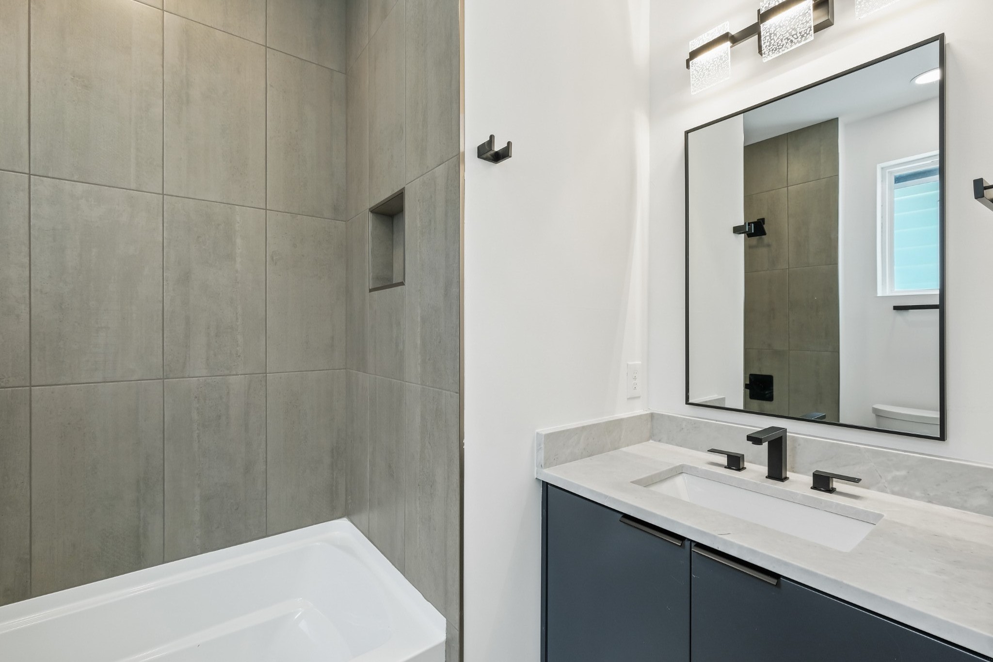 629 B Ries Avenue Nashville, TN 37209 - Photo 52 of 62 a bathroom with a sink and a mirror