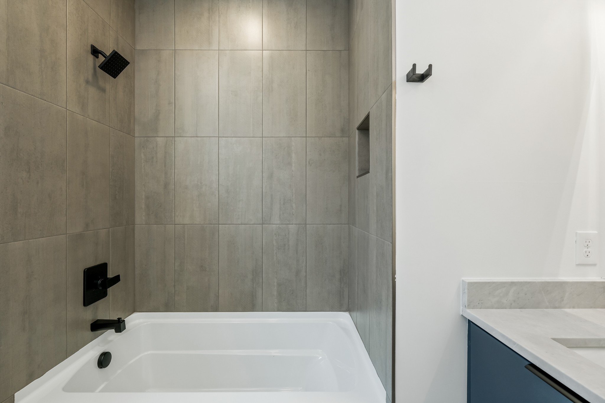 629 B Ries Avenue Nashville, TN 37209 - Photo 53 of 62 a bathroom with a granite countertop sink and a bathtub