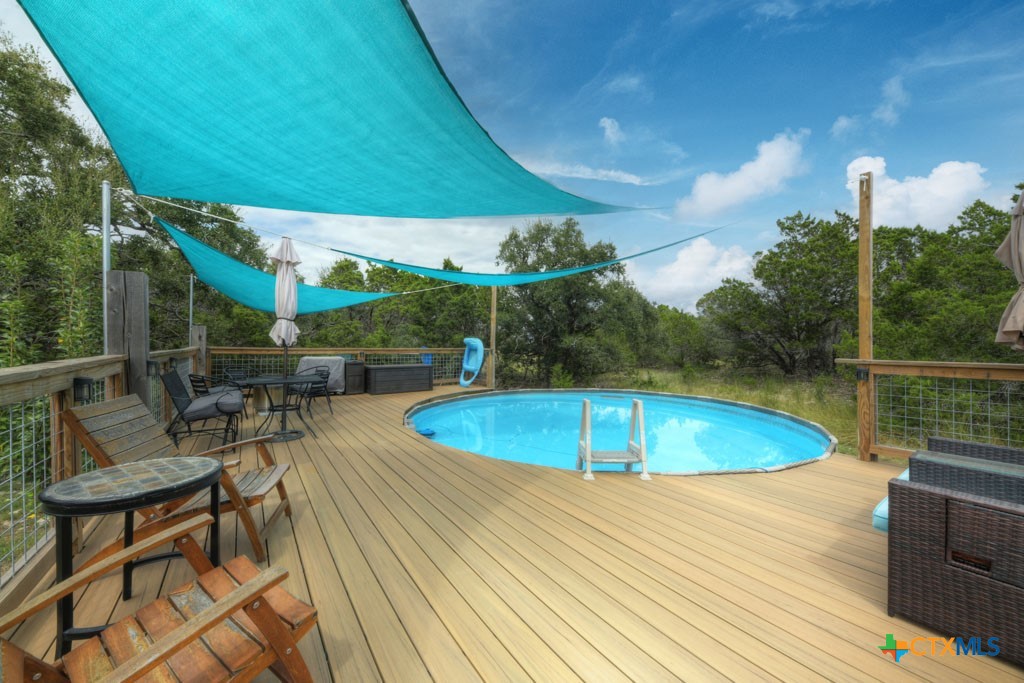 861 Rutherford Fischer, TX 78623 - Photo 19 of 38 Recently added(2023) composite decking with above ground pool.