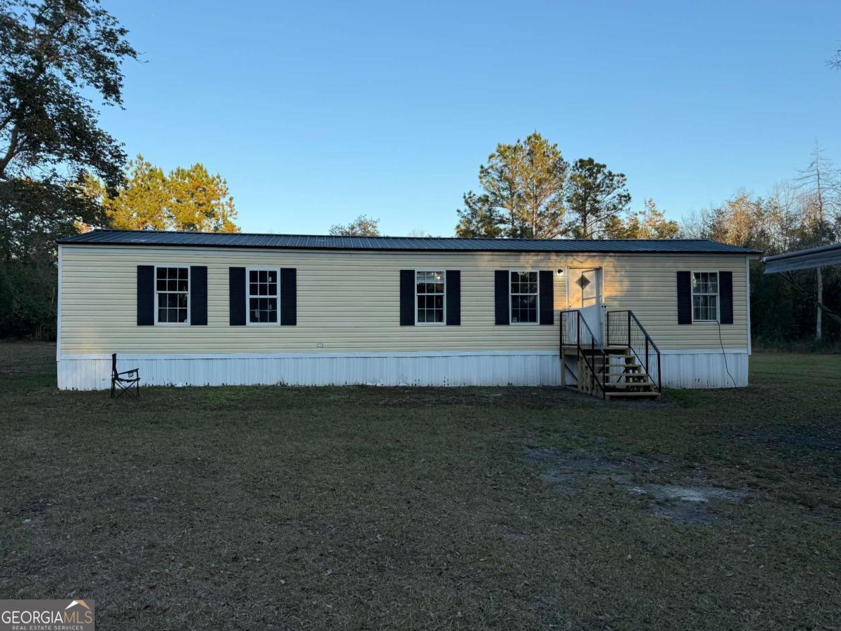4160 Deerwood Lane Blackshear, GA 31516 - Photo 1 of 1 a view of a house with backyard