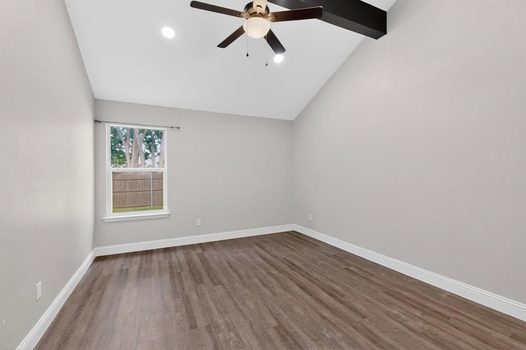 7729 Misty Ridge Drive North Fort Worth, TX 76137 - Photo 12 of 30 wooden floor in an empty room with a window