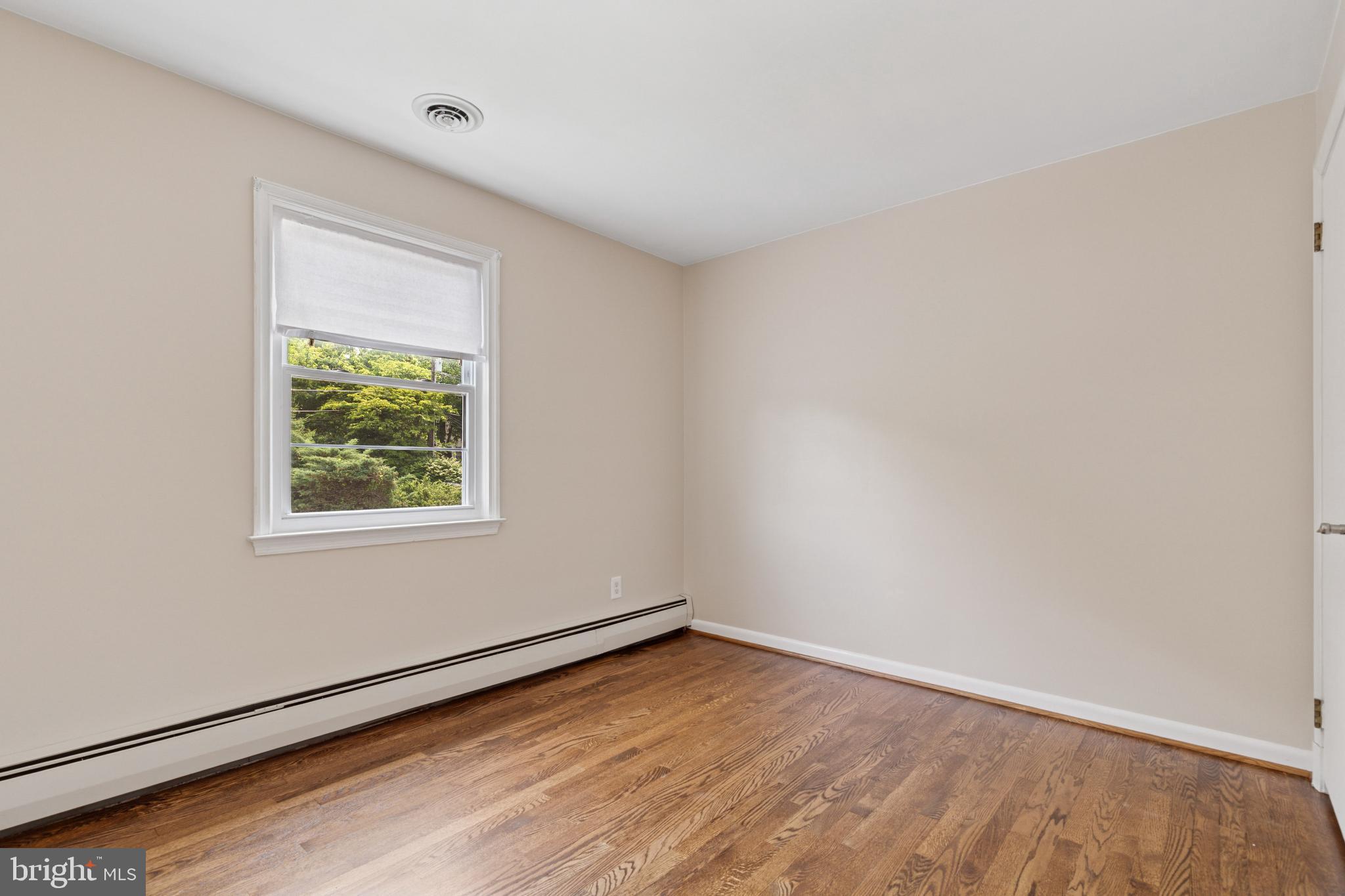 4009 High Point Road Ellicott City, MD 21042 - Photo 17 of 51 an empty room with wooden floor and windows