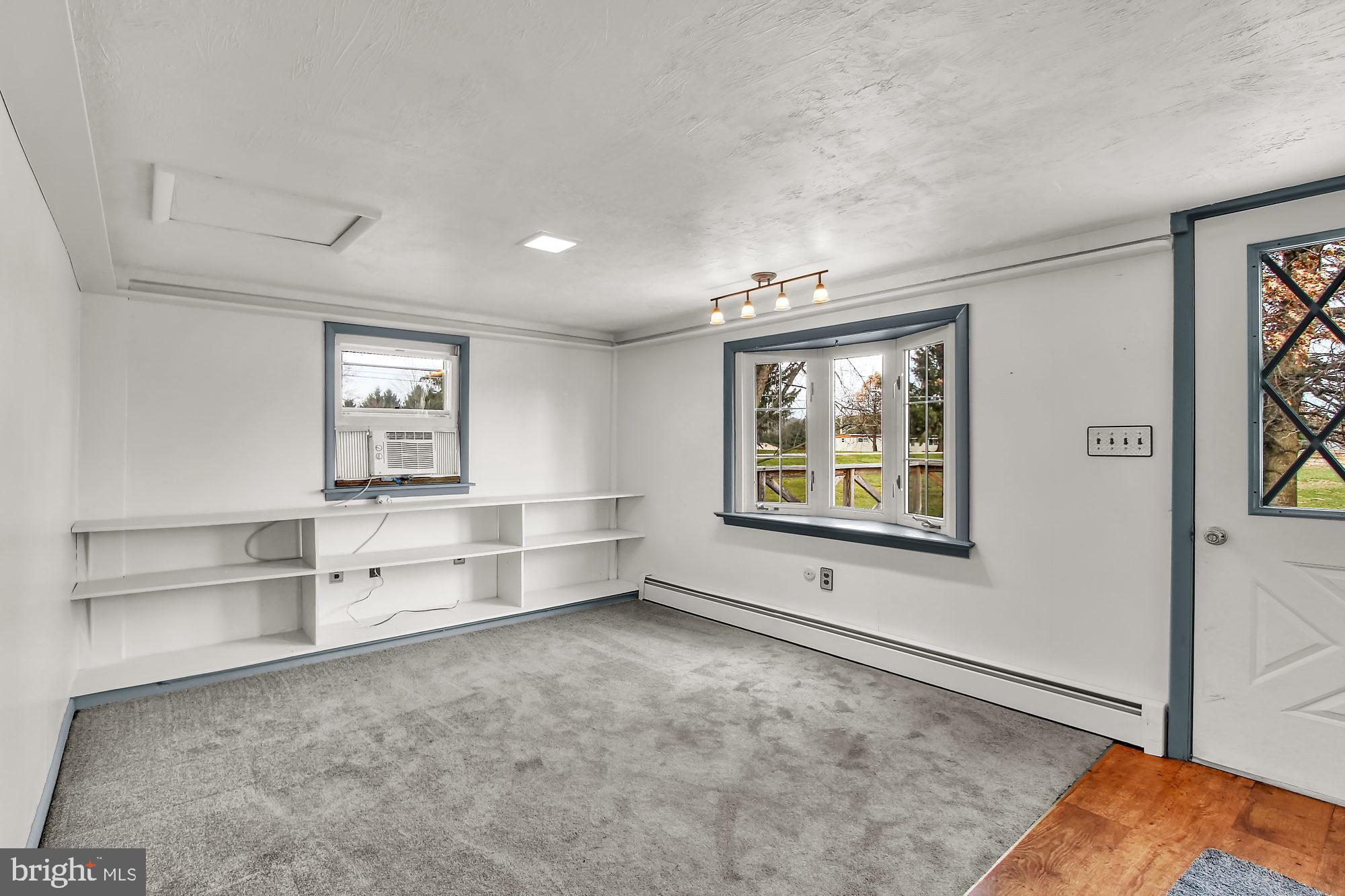 6121 Davidsburg Road Dover, PA 17315 - Photo 11 of 43 Family Room with book shelves