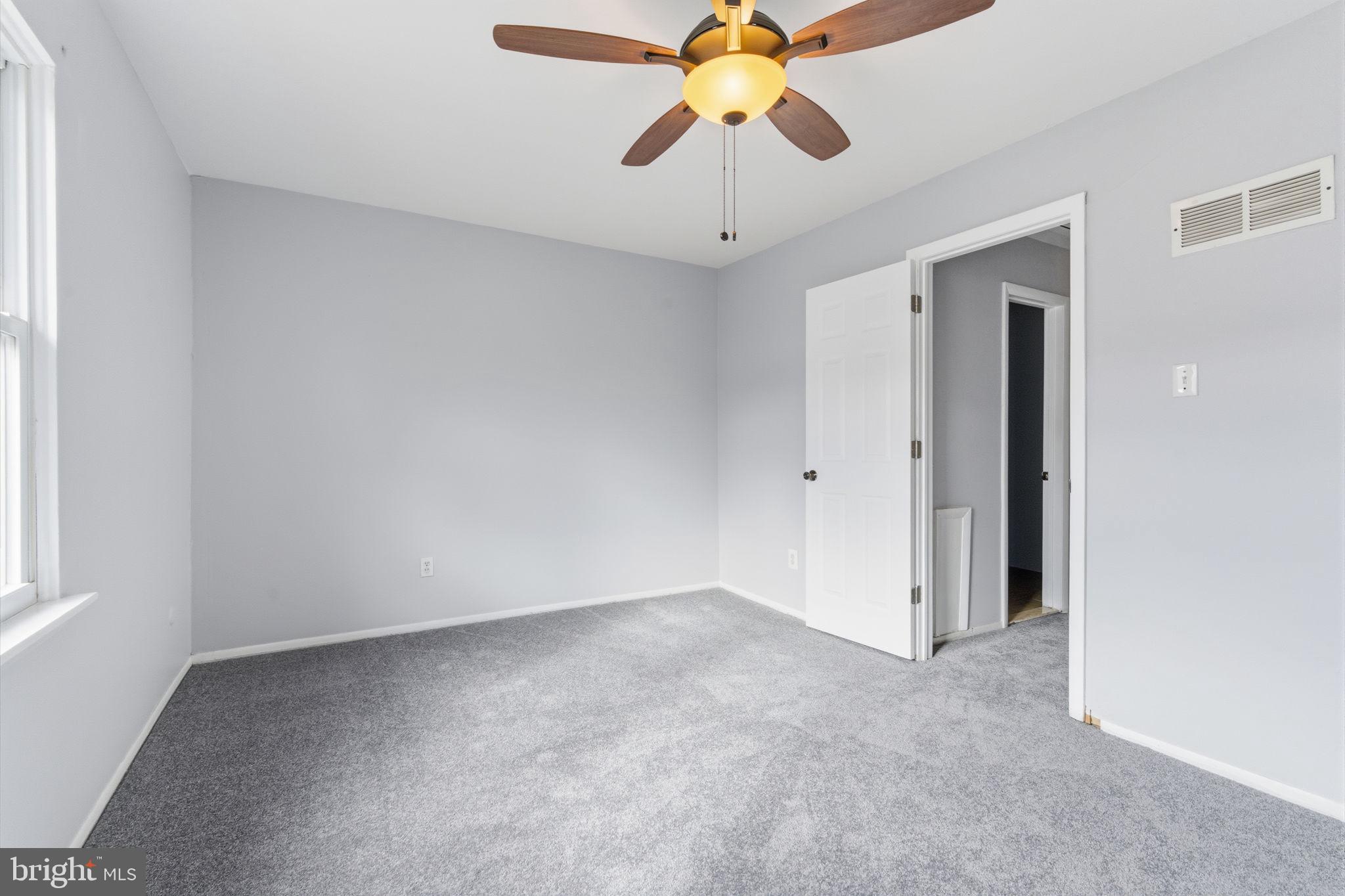 393 Rutgers Court Bensalem, PA 19020 - Photo 15 of 21 an empty room with chandelier fan