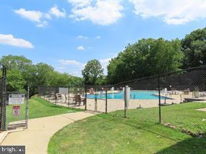 393 Rutgers Court Bensalem, PA 19020 - Photo 19 of 21 a view of a park with swings and a yard