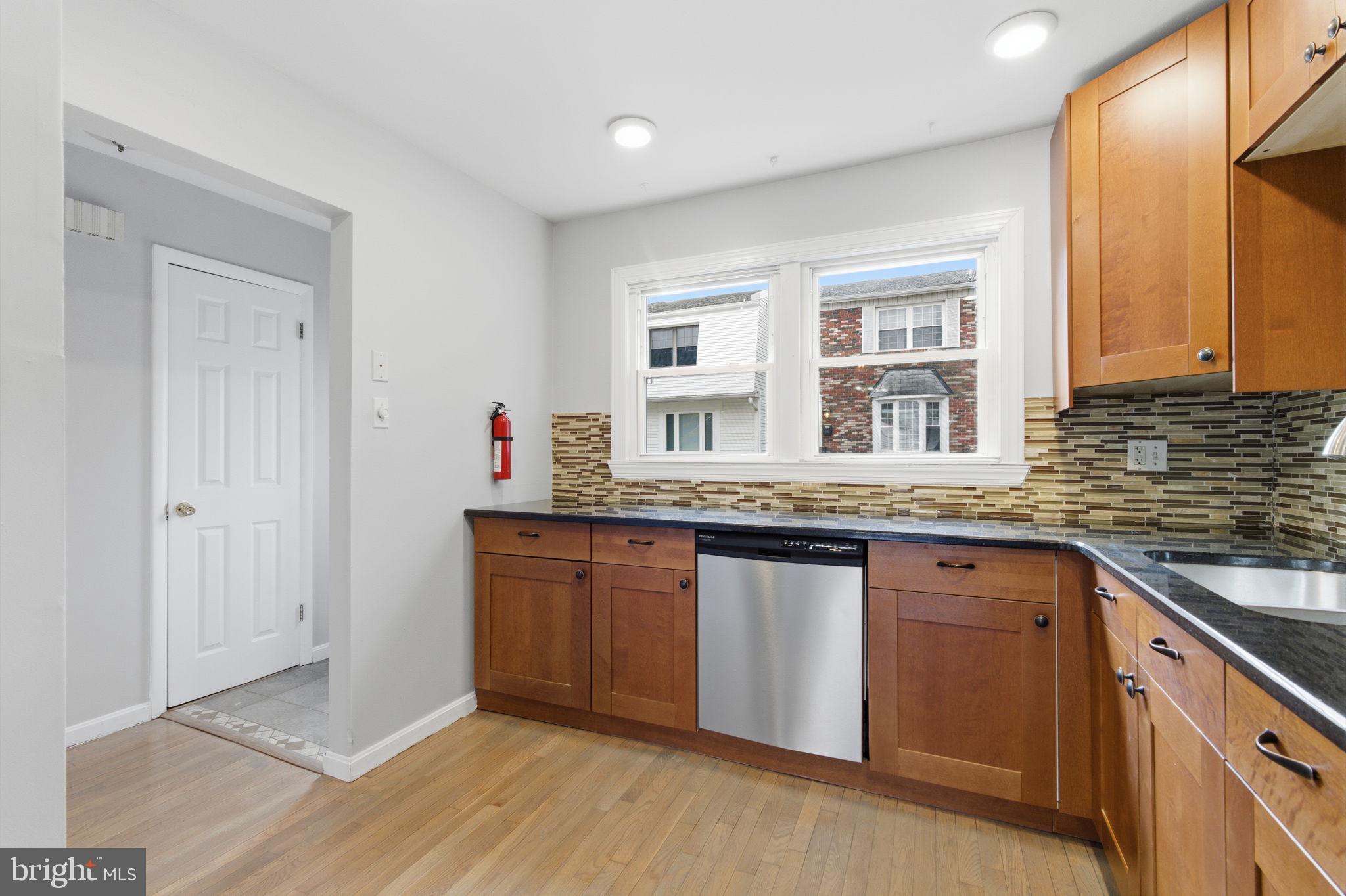 393 Rutgers Court Bensalem, PA 19020 - Photo 5 of 21 a kitchen with stainless steel appliances granite countertop a sink and cabinets