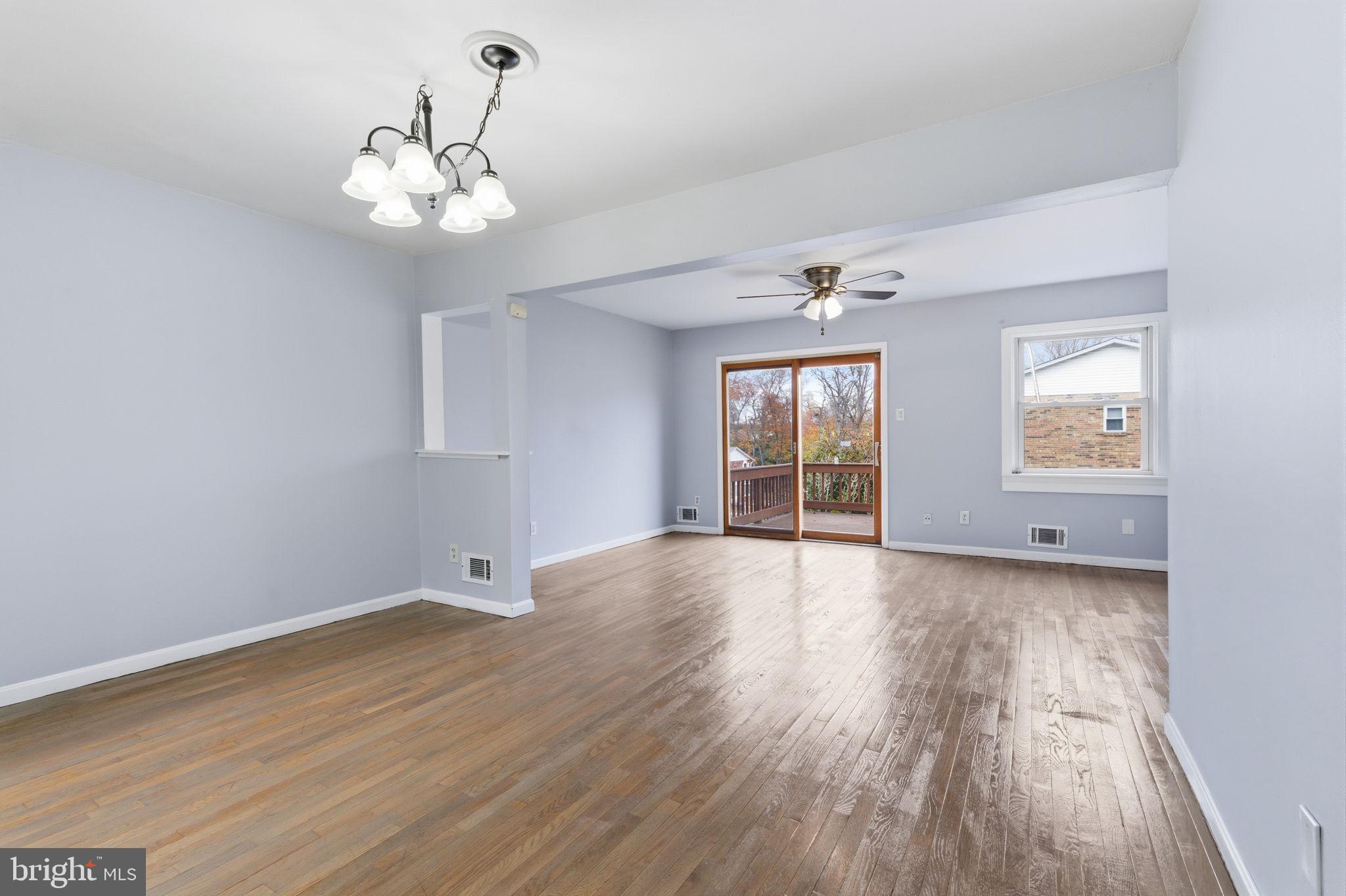 393 Rutgers Court Bensalem, PA 19020 - Photo 8 of 21 a view of an empty room with wooden floor and a window