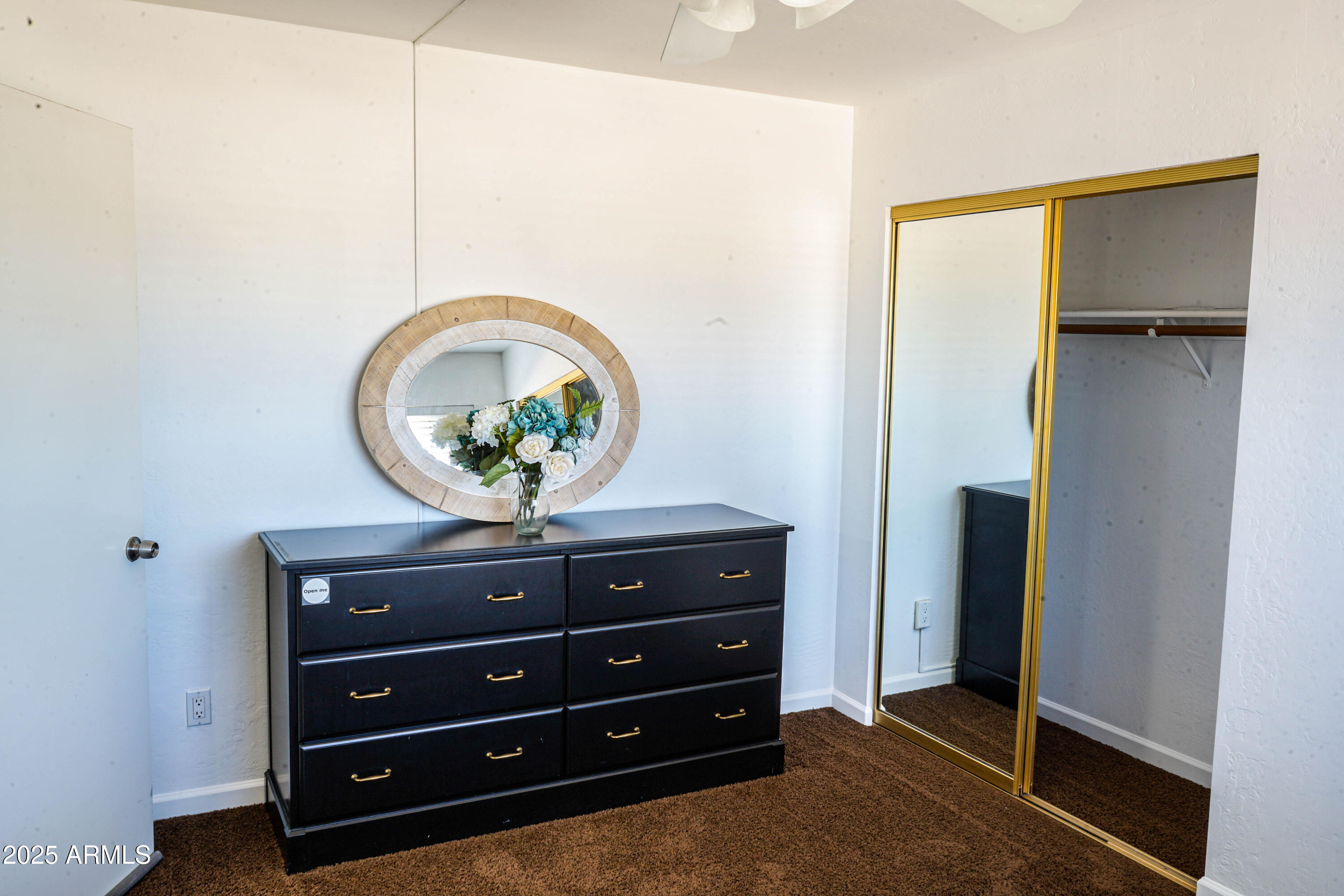 1126 West Elliot Road, Unit 1066 Chandler, AZ 85224 - Photo 12 of 21 a view of room with closet and mirror
