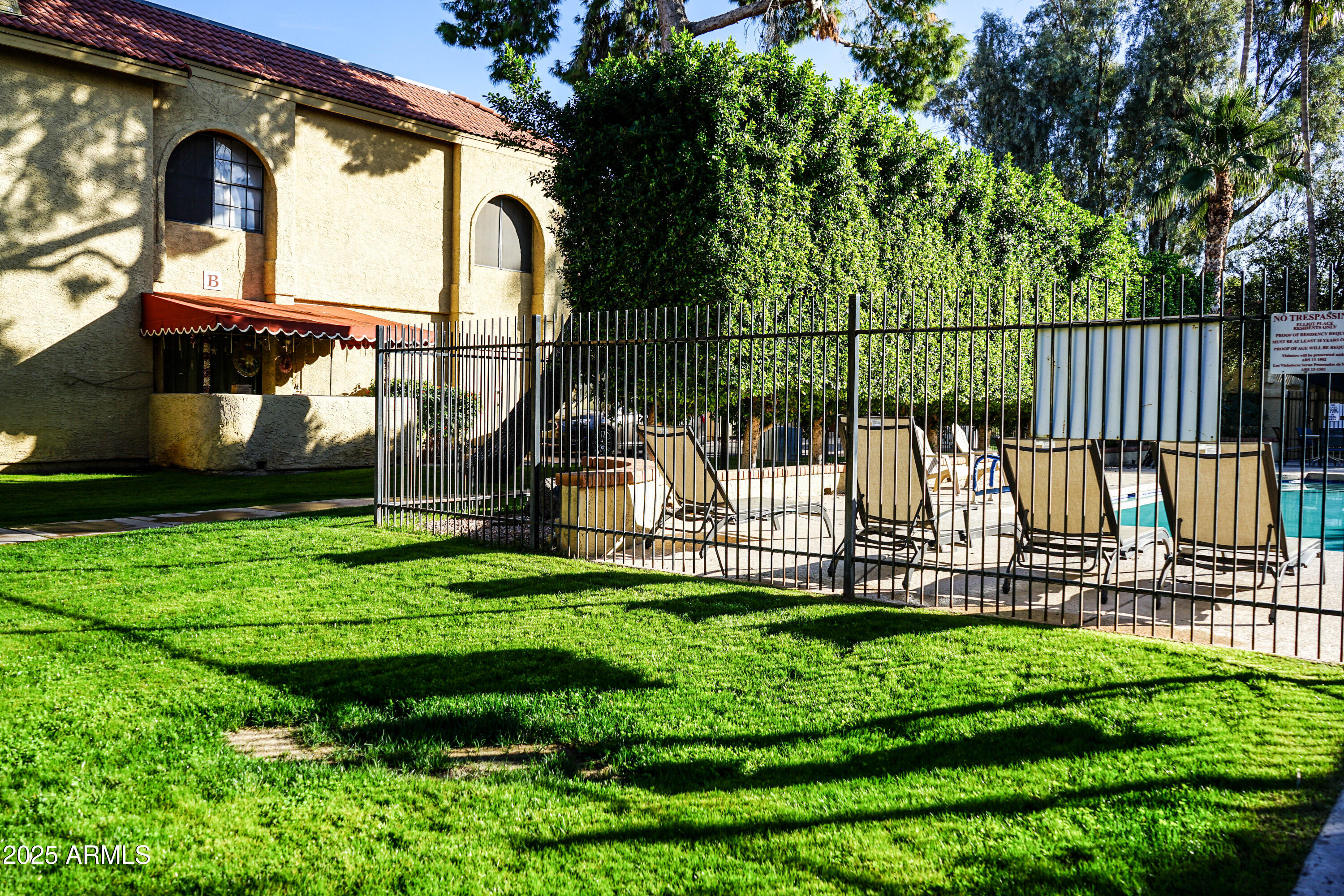 1126 West Elliot Road, Unit 1066 Chandler, AZ 85224 - Photo 20 of 21 a view of a garden with a slide