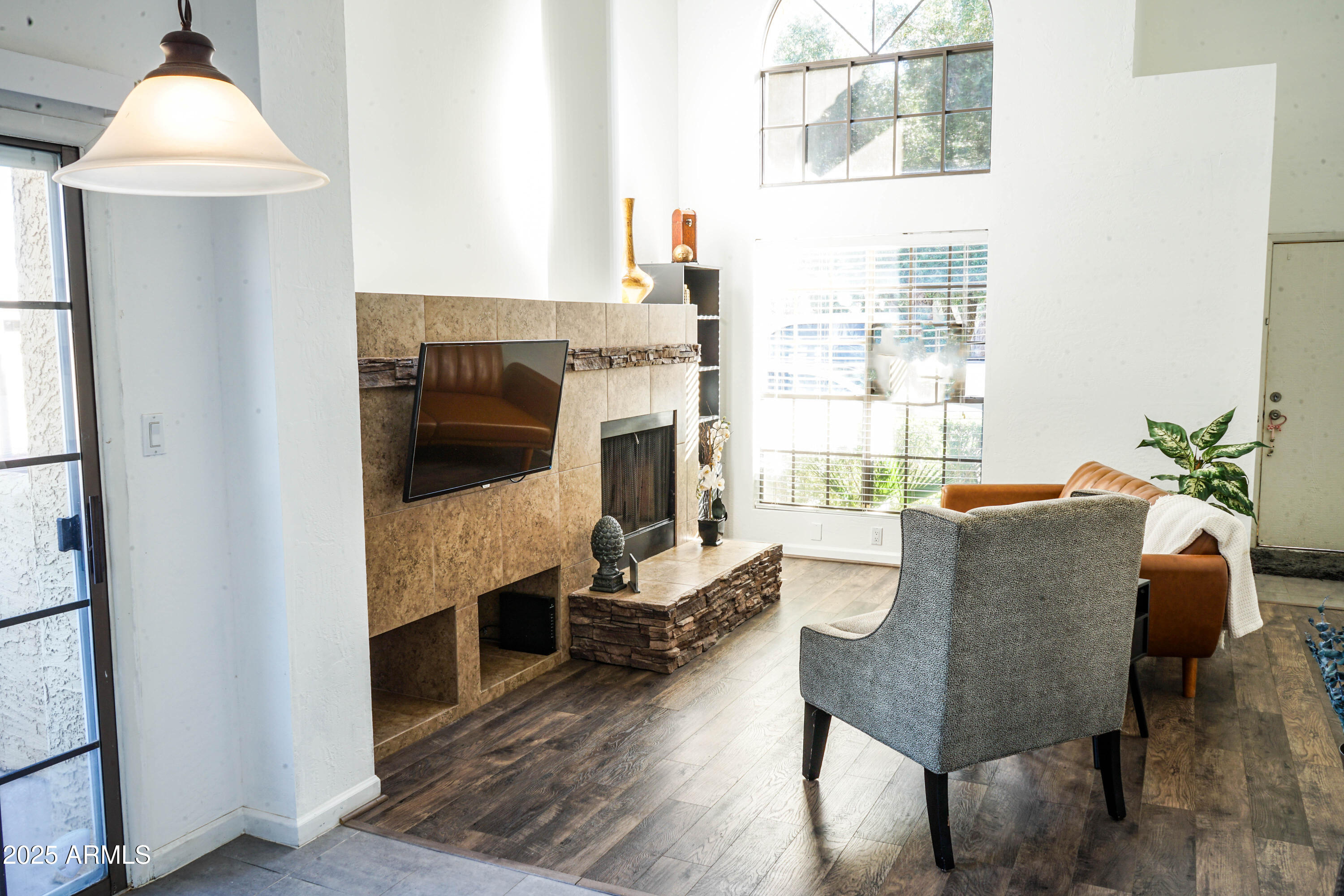 1126 West Elliot Road, Unit 1066 Chandler, AZ 85224 - Photo 6 of 21 a living room with furniture and a fireplace