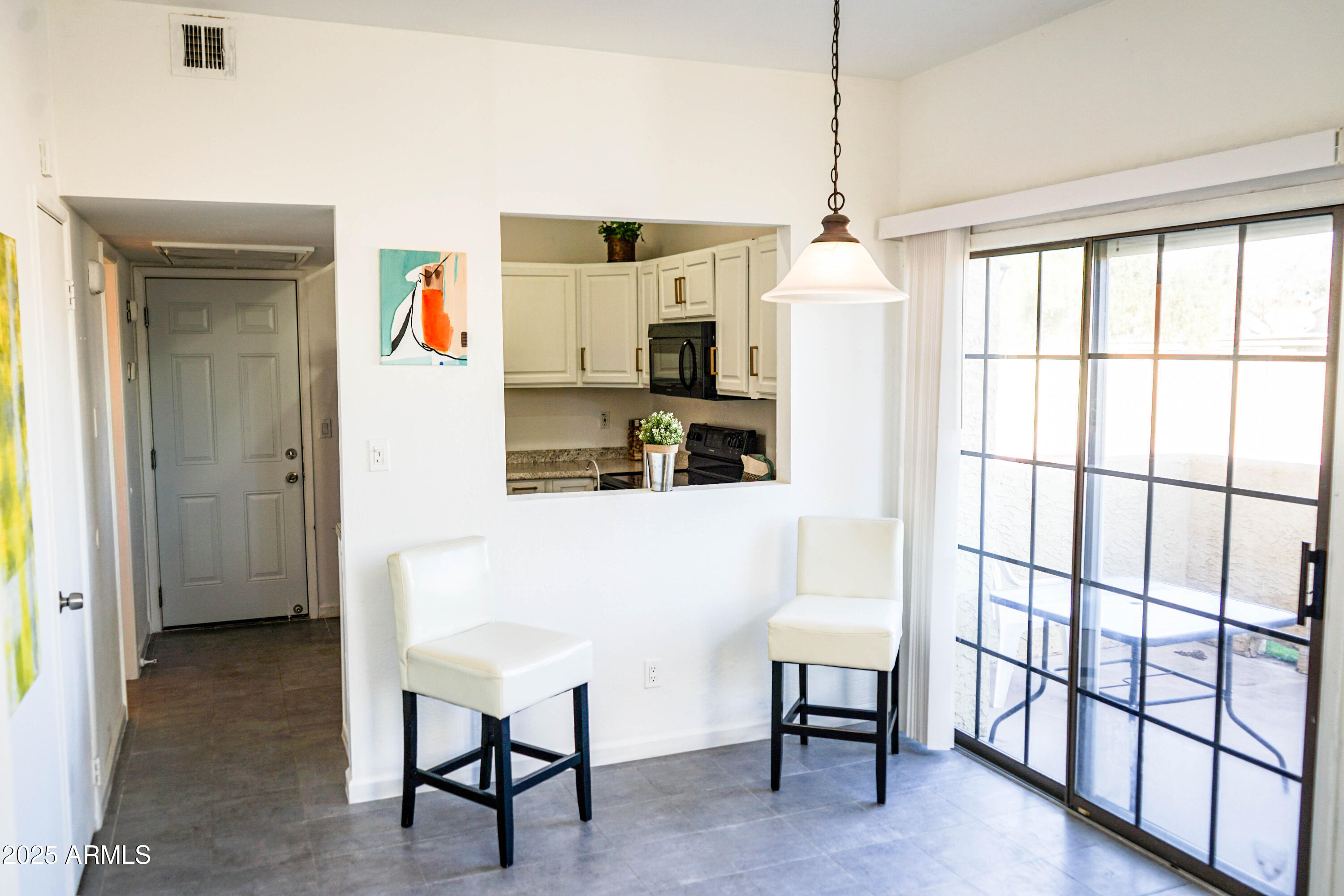 1126 West Elliot Road, Unit 1066 Chandler, AZ 85224 - Photo 8 of 21 a living room with furniture and a window