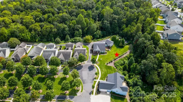 an aerial view of a house with a garden