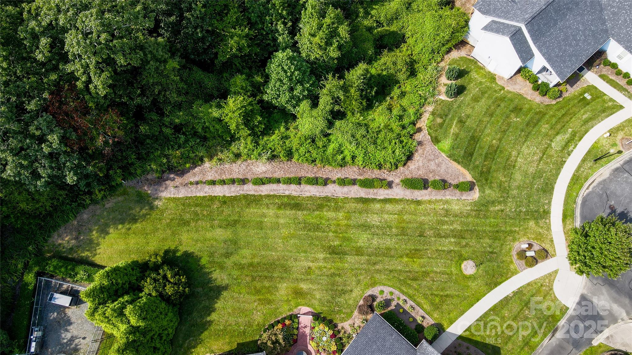 13264 Old Compton Court, Unit 45 Pineville, NC 28134 - Photo 5 of 12 a view of a lake from a building