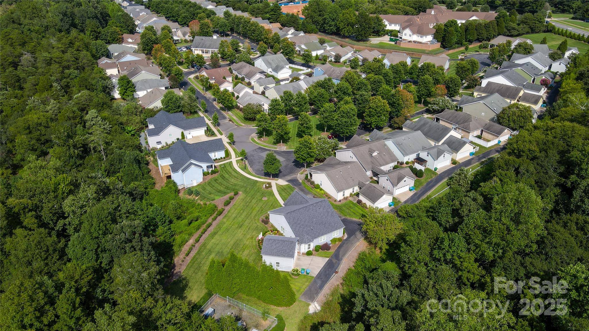 13264 Old Compton Court, Unit 45 Pineville, NC 28134 - Photo 6 of 12 an aerial view of residential houses with outdoor space and trees