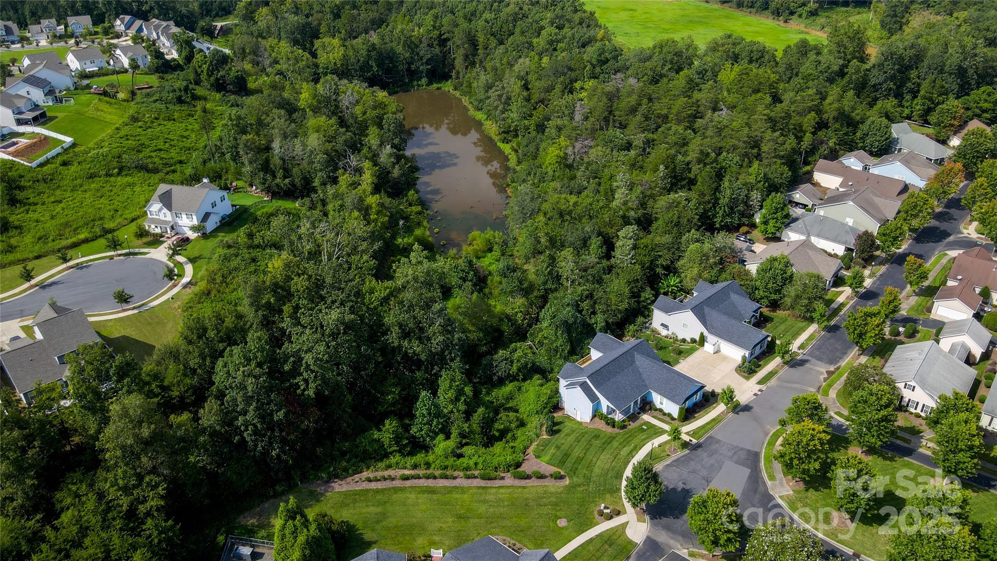 13264 Old Compton Court, Unit 45 Pineville, NC 28134 - Photo 7 of 12 an aerial view of residential house with outdoor space and swimming pool