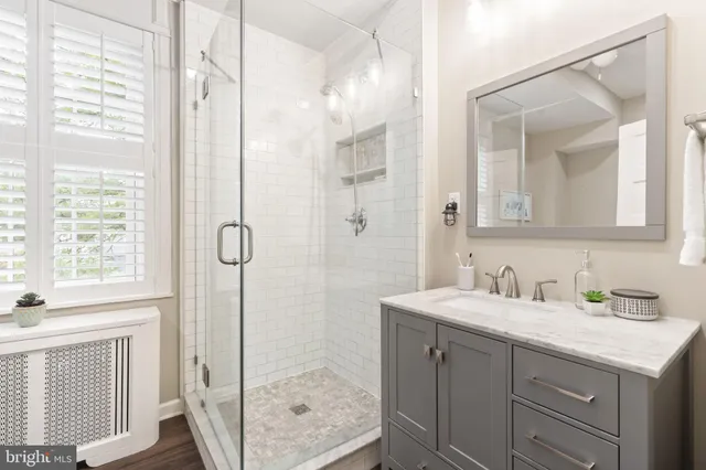 a bathroom with a bathtub and a window