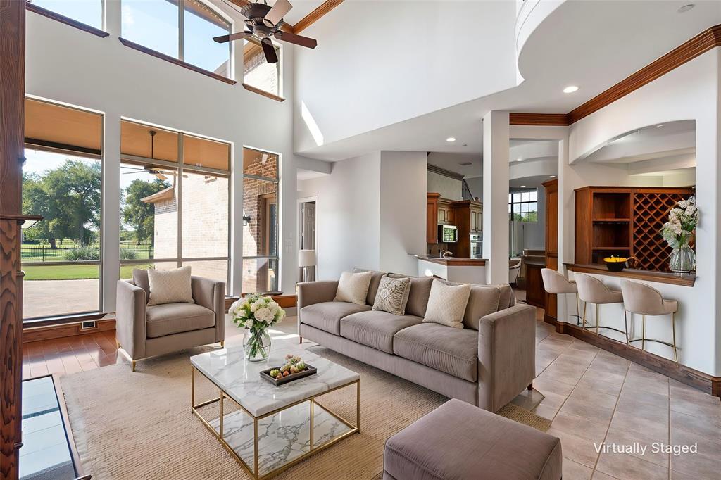1000 Saddlebrook Drive Lucas, TX 75002 - Photo 14 of 39 Living area with a high ceiling, ceiling fan, and crown molding