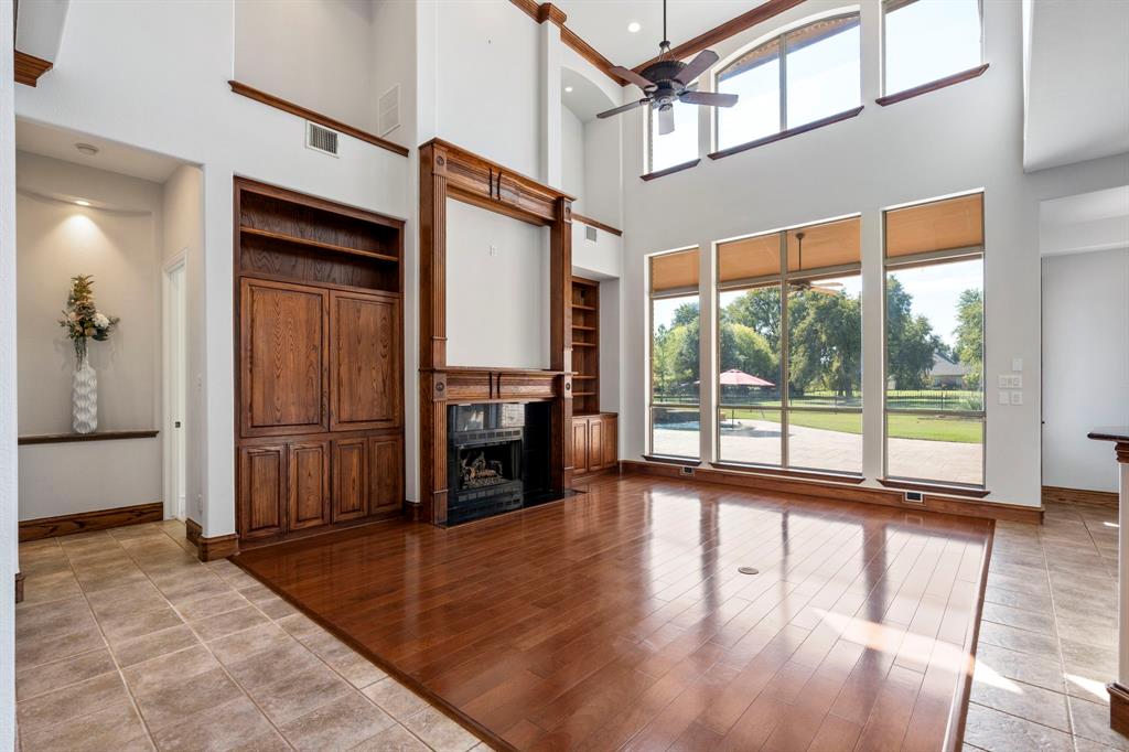 1000 Saddlebrook Drive Lucas, TX 75002 - Photo 15 of 39 Family room wiht wall of windows overlooking back patio and pool