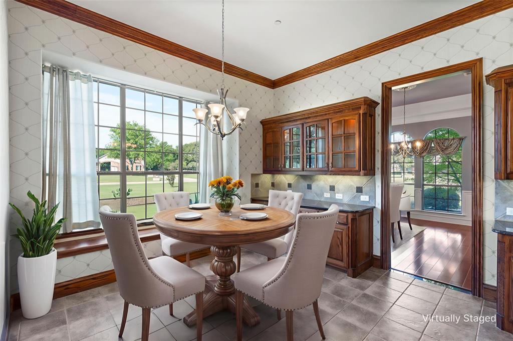 1000 Saddlebrook Drive Lucas, TX 75002 - Photo 17 of 39 Dining room with a chandelier, wallpapered walls, and crown molding