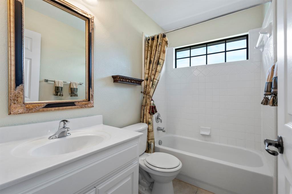 1000 Saddlebrook Drive Lucas, TX 75002 - Photo 30 of 39 Full bathroom with shower / bathtub combination with curtain, vanity, and light tile patterned floors